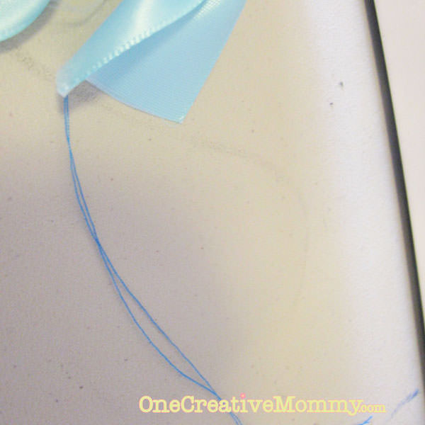 Leave at least four inches of thread at the end of the ribbon