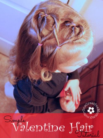 Create this easy Valentine hair style in ten minutes or less! I'll show you how. {Valentines Day heart hair style for little girls on OneCreativeMommy.com}