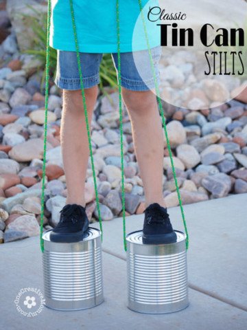 Just in time for summer, recycle tin cans into a classic toy -- Tin Can Stilts! {OneCreativeMommy.com} I remember playing with these when I was a kid!