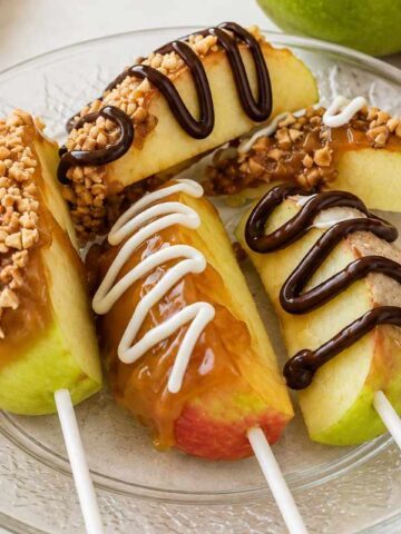 Caramel apple pops with nuts and chocolate drizzle