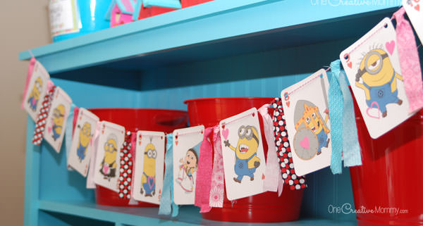 Looking for a quick and easy Valentine decor idea? All you need for this fun Valentine's Day banner is a deck of playing cards, scrap fabric, and baker's twine. {Simple tutorial from OneCreativeMommy.com} Create a traditional version, or go wild with Despicable Me!