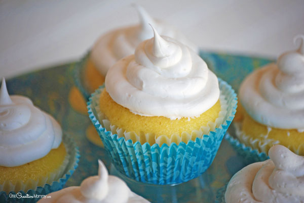 You'll never believe these amazing Lemon Pound Cake Cupcakes are gluten free! An irresistibly moist and delicious dessert recipe! {OneCreativeMommy.com} Can you guess the secret ingredient?