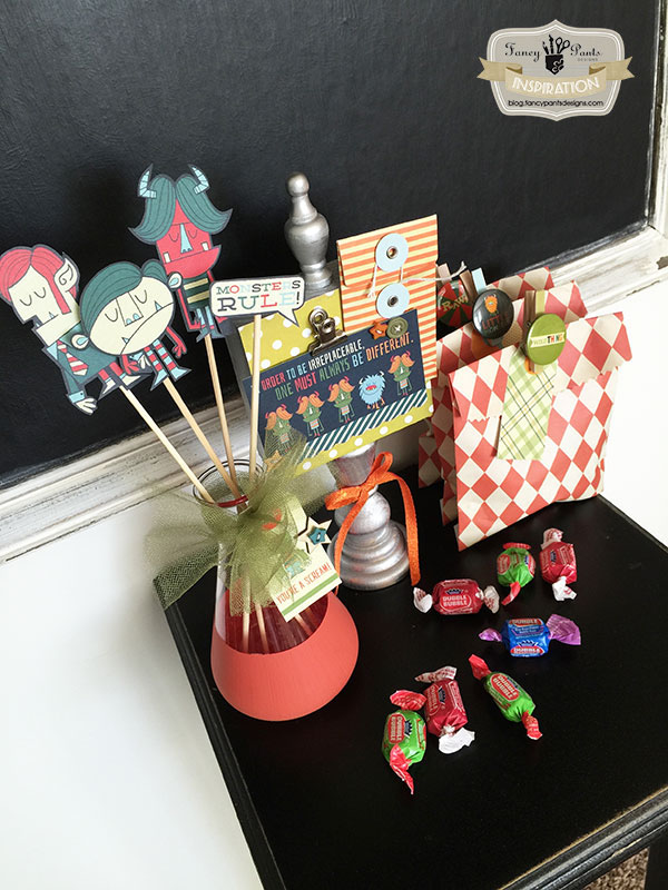 Use adorable Monsters scrapbook paper to create this cute Halloween decor and these fun treat bags! {Jodi of Fancy Pants Designs on OneCreativeMommy.com} Cool Halloween Ideas!