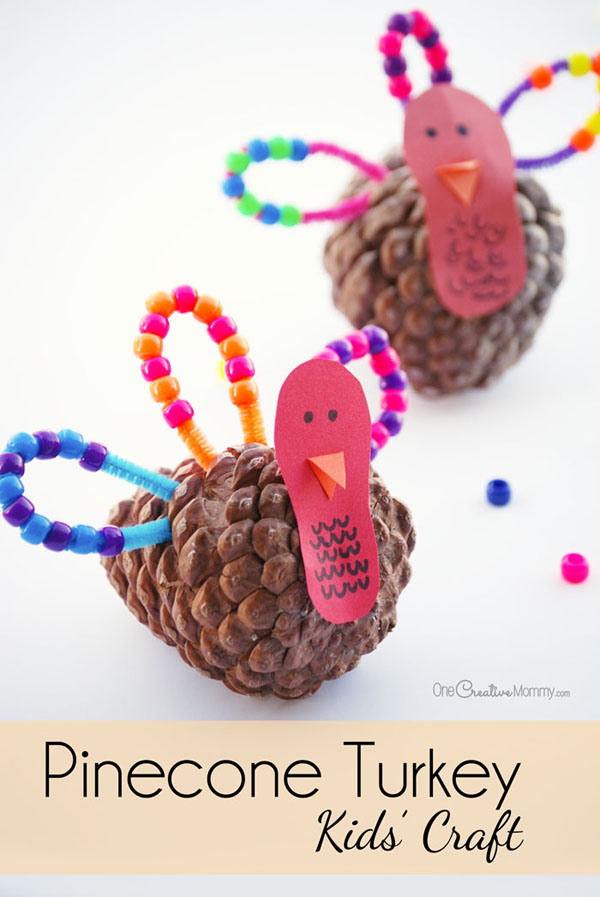 Let the kids make turkeys while you make Thanksgiving dinner! Fun pinecone turkey craft for kids {OneCreativeMommy.com}