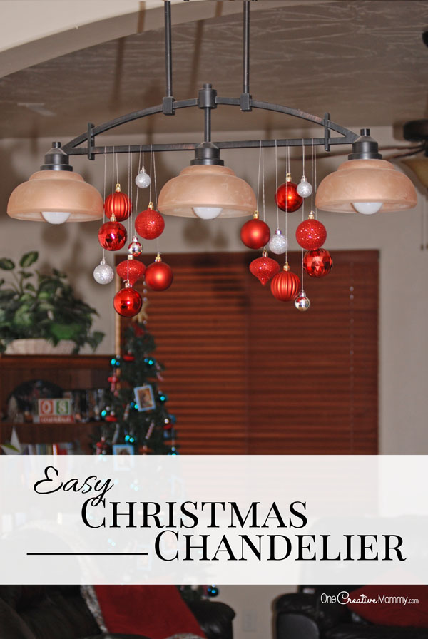 Turn an ordinary light fixture into a beautiful Christmas chandelier in just a few minutes! {OneCreativeMommy.com} This is the easiest Christmas decor ever!