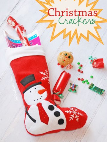 Too much candy in the Christmas stocking because Santa is trying to give to give the kids all of their favorites? Mix it up (literally). Try these adorable Christmas Crackers Stocking Stuffers! {OneCreativeMommy.com} Simple tutorial