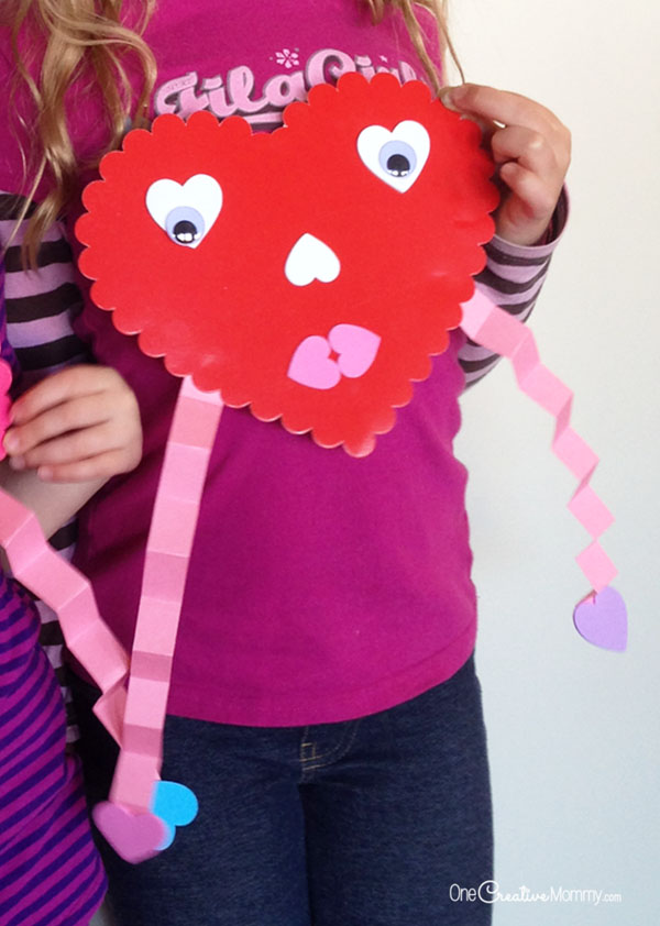 Not crafty? No problem. This Valentine Craft is so easy that anyone can do it! It's perfect for a Valentine Class party! {OneCreativeMommy.com}