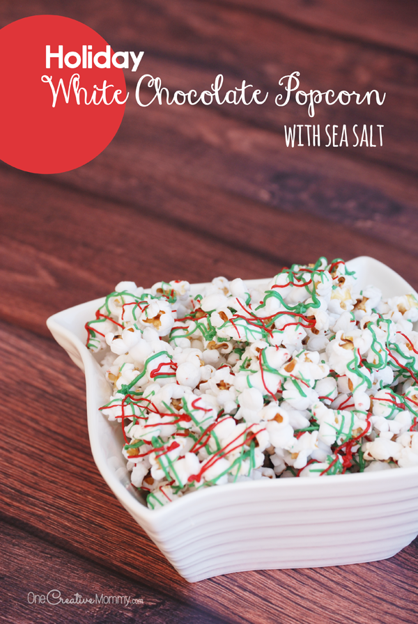 This delicious Holiday White Chocolate Popcorn with Sea Salt is a perfect snack or neighbor gift! {OneCreativeMommy.com} Christmas Recipe | Neighbor Gift Idea