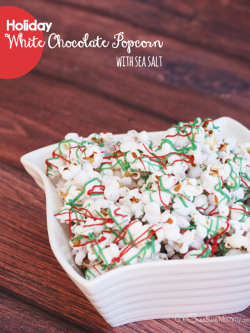 This delicious Holiday White Chocolate Popcorn with Sea Salt is a perfect snack or neighbor gift! {OneCreativeMommy.com} Christmas Recipe | Neighbor Gift Idea