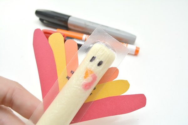 Cheese Stick Turkey Craft from Wonder Mom Wannabe | Featured in the Ultimate Turkey Crafts for Kids Roundup {OneCreativeMommy.com}