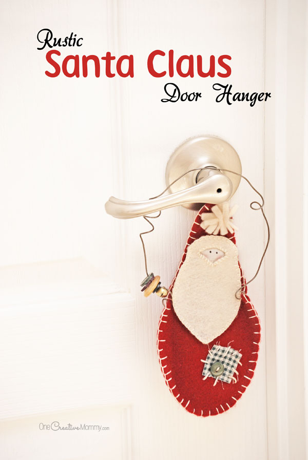 Rustic Santa Claus Door Hangers make perfect gifts for teachers, friends and neighbors. They're easy to make, and they look so darn cute! {OneCreativeMommy.com} Christmas Craft Tutorial #santaclaus #christmascraft #christmasdecor #felt #giftidea #doorhanger