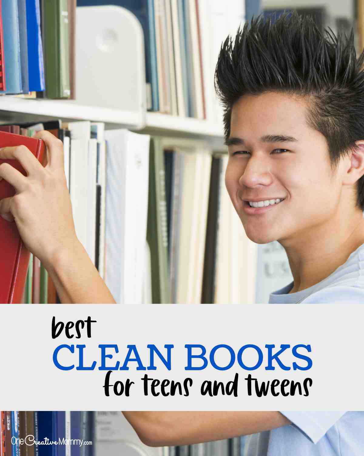 Smiling teenage boy selecting a book from a library shelf