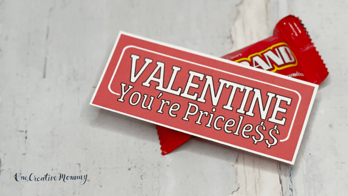 A small 100 Grand candy bar is shown with a Valentine's Day card that says, Valentine, you're pricele$$