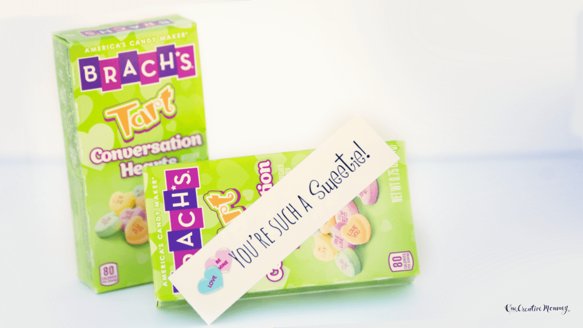 Two green boxes of Valentine's Day Conversation Hearts candy are show with a tag that says, You're such a sweetie!