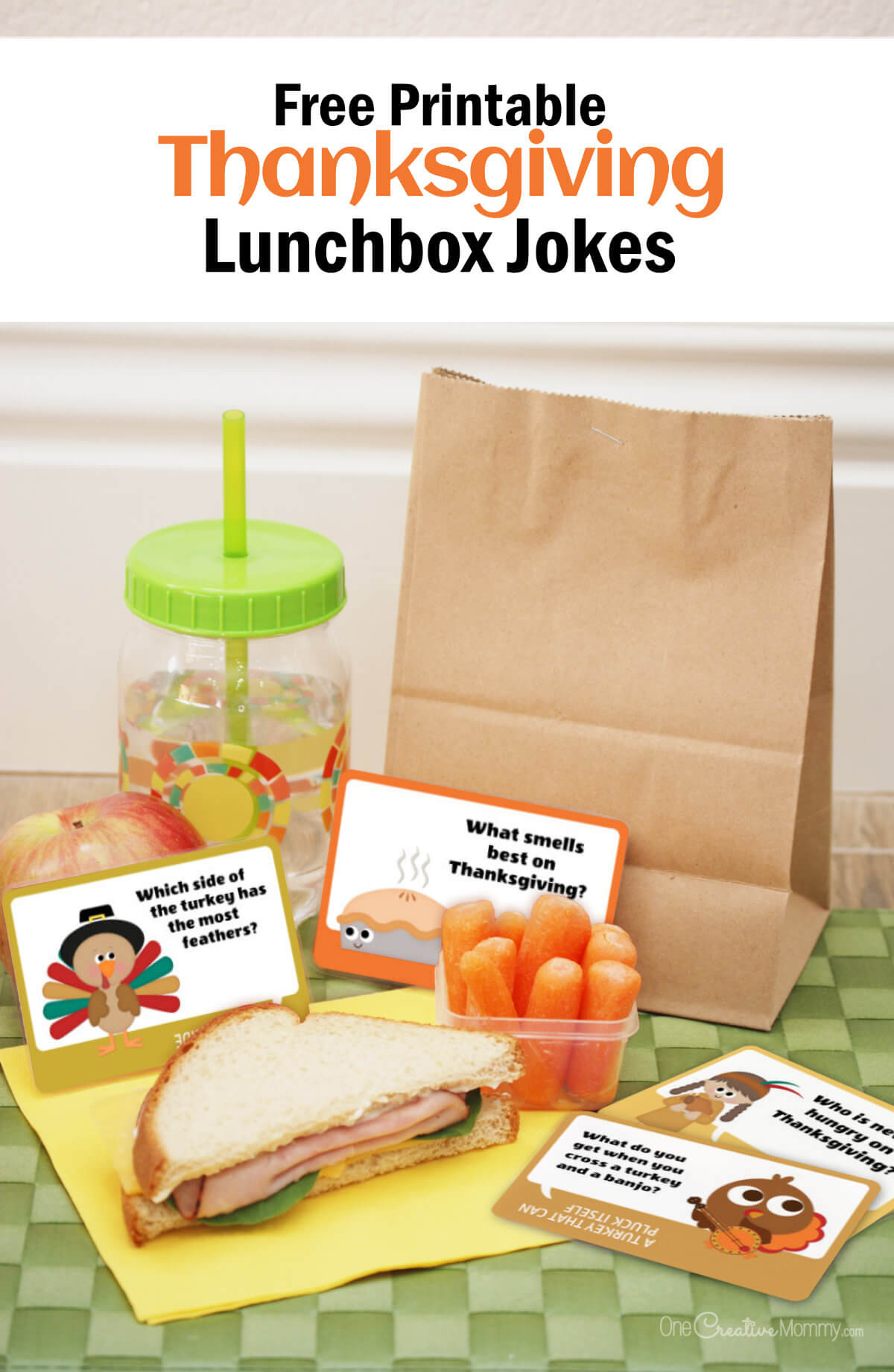 A child's lunch is spread out on a green placemat. There is a yellow napkin under half a turkey sandwich, a small container or baby carrots, an apple, and a drink bottle. Those items sit in front of a brown paper lunch sack, and there are 4 Thanksgiving lunchbox jokes scattered among them. On top of the images is lettering that reads: Free Printable Thanksgiving Lunchbox Jokes.