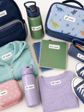 Waterproof name labels on a backpack, lunchbox, water bottle, school notebooks, pencil case, and clothing.