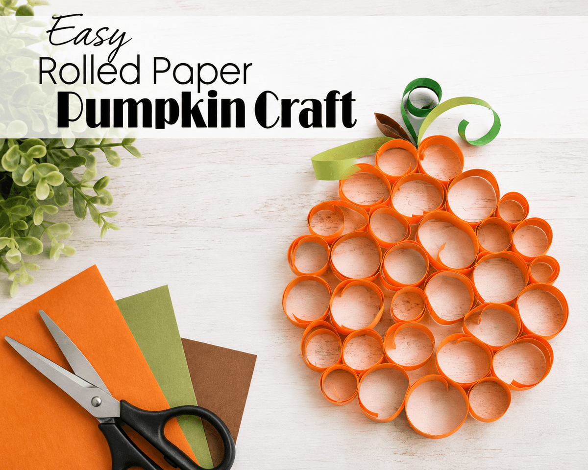 Rolled paper pumpkin craft for kids with orange paper circles