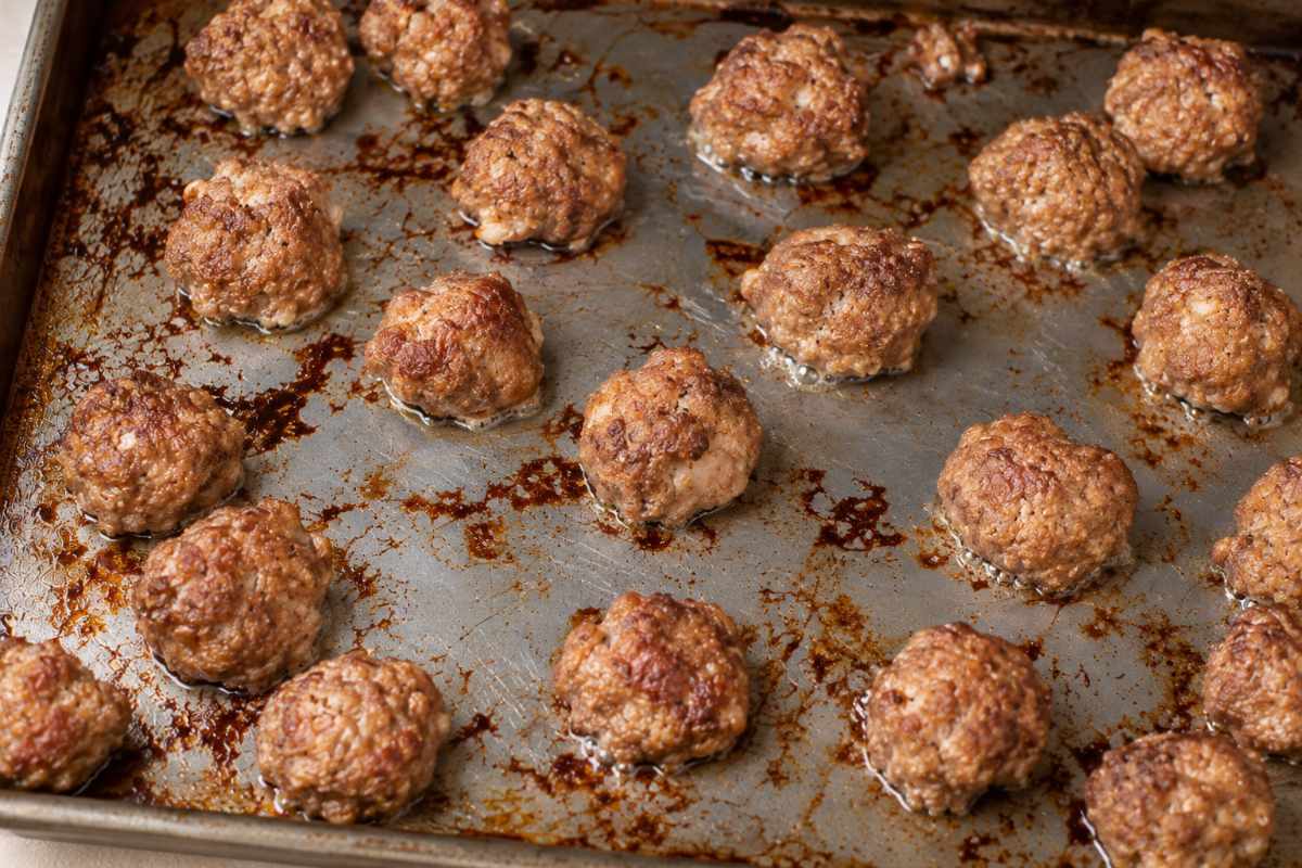 Homemade meatballs baked on a cookie sheet for meatball chili